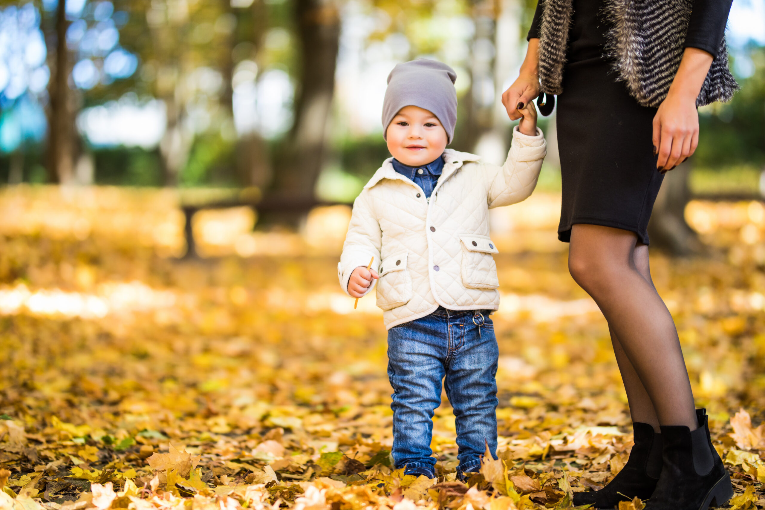 Mom and son walking in a park